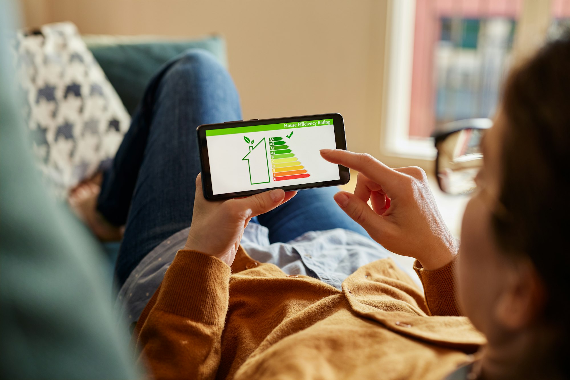 Girl checking the energy efficiency of her home